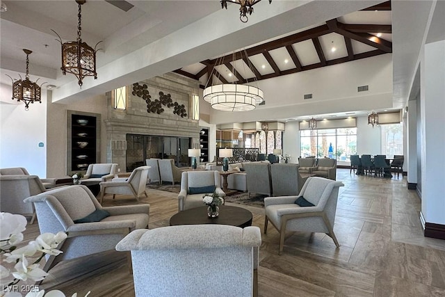 building lobby with high vaulted ceiling and beamed ceiling