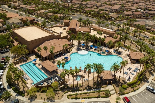 aerial view of residential area with a pool