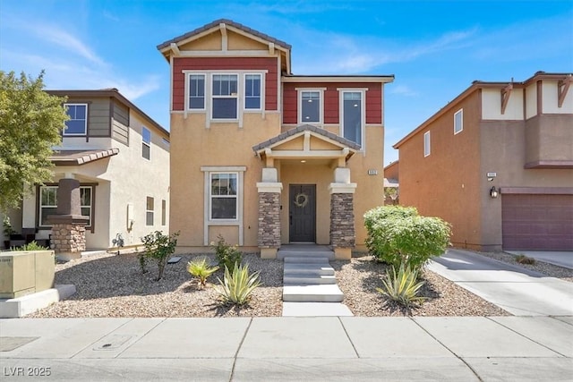 view of front of property featuring stone siding and stucco siding