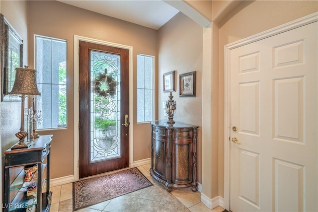 4419 Via Bianca Ave, Las Vegas, NV 89141 - foyer entrance featuring healthy amount of natural light, arched walkways, baseboards, and light tile patterned flooring