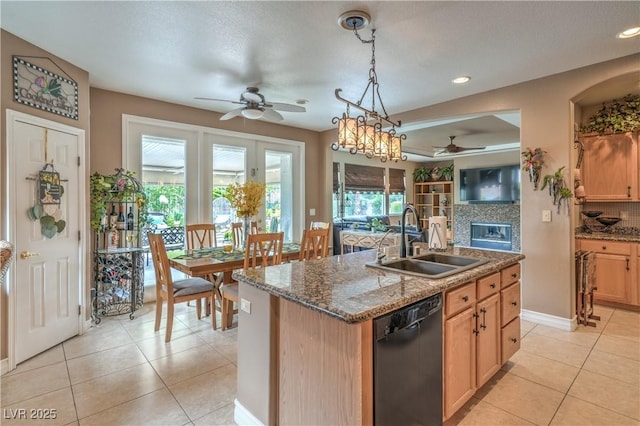 4419 Via Bianca Ave, Las Vegas, NV 89141 - kitchen featuring ceiling fan, a sink, black dishwasher, light tile patterned floors, and tasteful backsplash