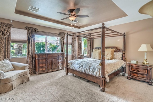 4419 Via Bianca Ave, Las Vegas, NV 89141 - carpeted bedroom featuring a raised ceiling and a ceiling fan