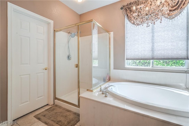 4419 Via Bianca Ave, Las Vegas, NV 89141 - full bathroom featuring a stall shower, a bath, and tile patterned floors