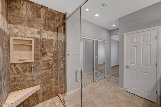 bathroom featuring a stall shower, recessed lighting, and tile patterned flooring