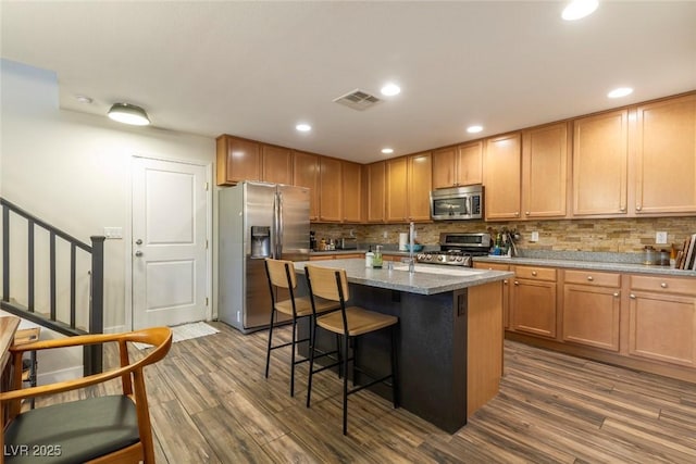 9925 Turquoise Glass Ct, Las Vegas, NV 89178 - kitchen featuring stainless steel appliances, dark wood finished floors, backsplash, and recessed lighting