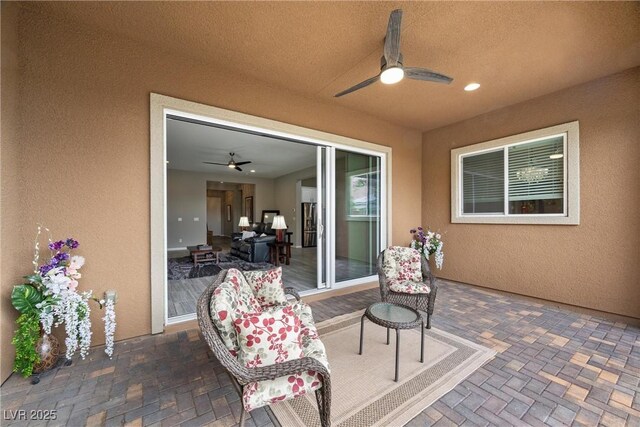 view of patio with ceiling fan