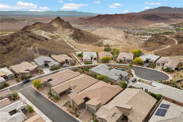 aerial view of property and surrounding area with nearby suburban area and mountains