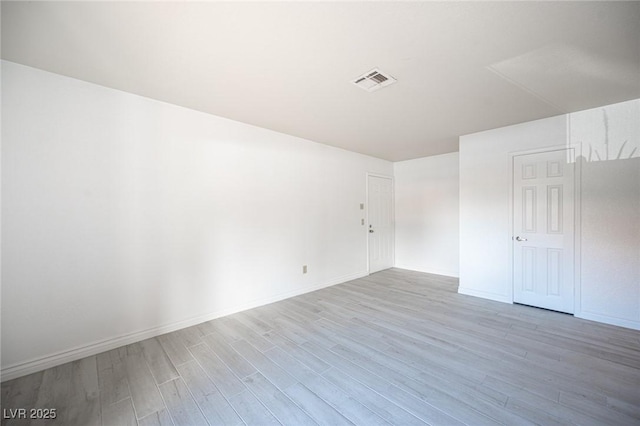 2606 S Durango Dr Unit 122, Las Vegas, NV 89117 - unfurnished room featuring light wood-style floors and baseboards