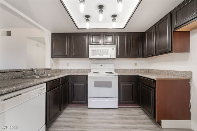 611 Bass Dr Unit C, Henderson, NV 89014 - kitchen featuring white appliances, a sink, and dark brown cabinetry