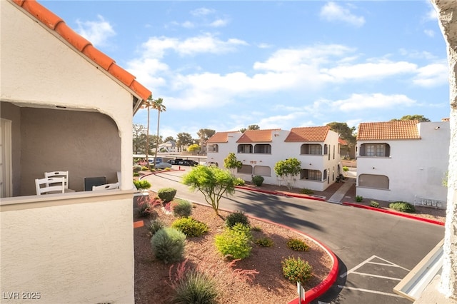 611 Bass Dr Unit C, Henderson, NV 89014 - view of asphalt road featuring a residential view and curbs