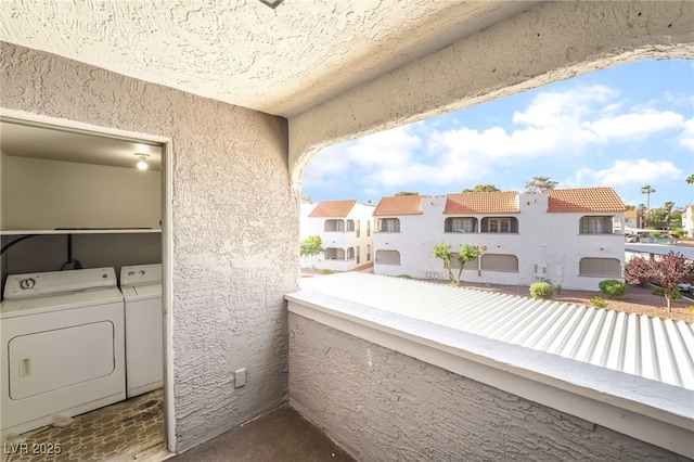 611 Bass Dr Unit C, Henderson, NV 89014 - balcony with washer and clothes dryer and a residential view