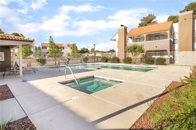611 Bass Dr Unit C, Henderson, NV 89014 - community pool featuring fence, a community hot tub, and a patio