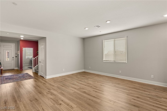 5449 Hickory Tree St, Las Vegas, NV 89149 - unfurnished room with stairway, light wood finished floors, recessed lighting, and baseboards