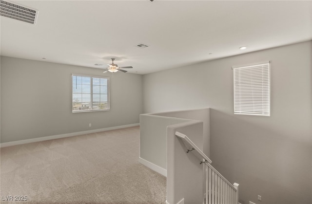 5449 Hickory Tree St, Las Vegas, NV 89149 - empty room with baseboards, light colored carpet, and a ceiling fan