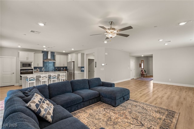 5449 Hickory Tree St, Las Vegas, NV 89149 - living area with recessed lighting, light wood-style flooring, baseboards, and ceiling fan