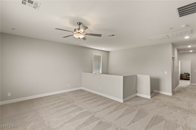 5449 Hickory Tree St, Las Vegas, NV 89149 - empty room with light carpet, a ceiling fan, and baseboards