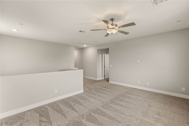 5449 Hickory Tree St, Las Vegas, NV 89149 - spare room featuring light colored carpet, a ceiling fan, baseboards, and recessed lighting