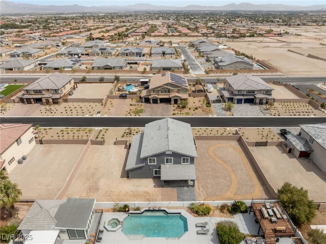 5449 Hickory Tree St, Las Vegas, NV 89149 - aerial view of residential area with a mountain backdrop and a pool area