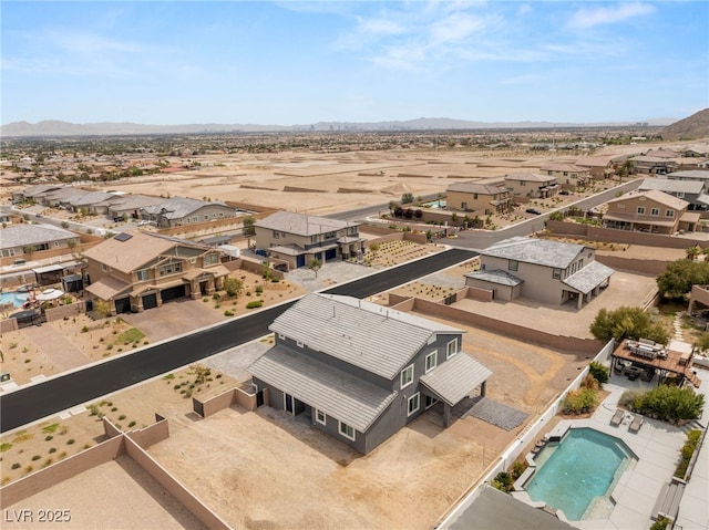 5449 Hickory Tree St, Las Vegas, NV 89149 - aerial view of residential area featuring mountains, a pool area, and a desert landscape