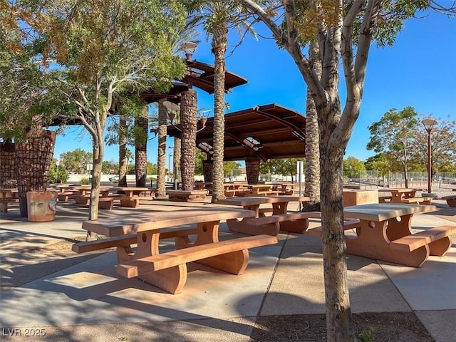view of home's community featuring a patio area and outdoor dining area