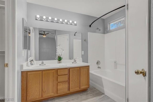 bathroom with shower / tub combination, ceiling fan, double vanity, and wood finished floors
