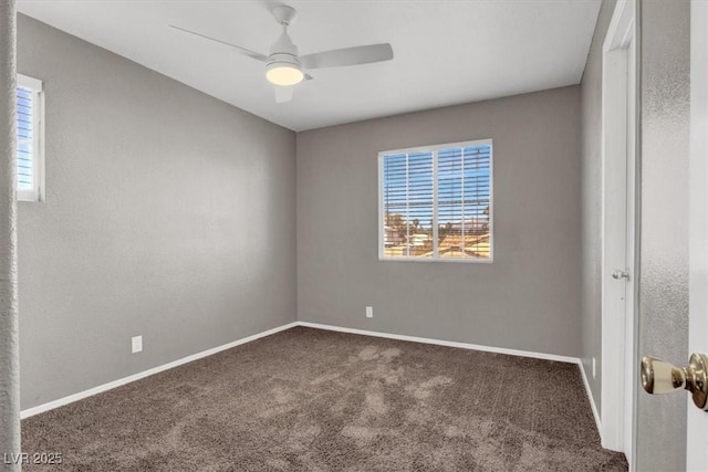 unfurnished room featuring carpet flooring, plenty of natural light, ceiling fan, and baseboards