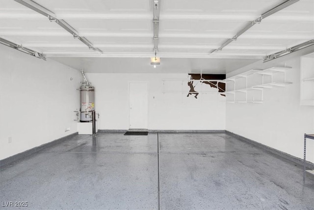 garage featuring water heater and baseboards
