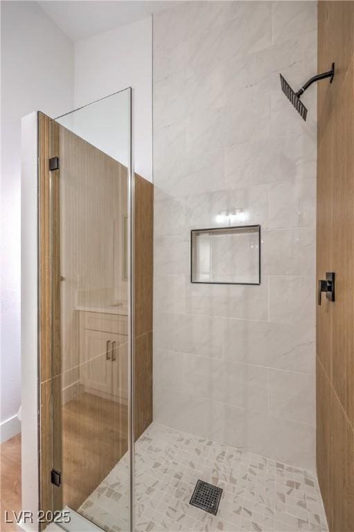 bathroom with a shower stall