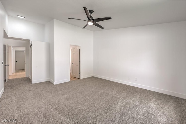 unfurnished bedroom featuring carpet flooring, baseboards, and ceiling fan