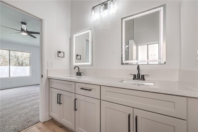 full bathroom featuring double vanity and ceiling fan