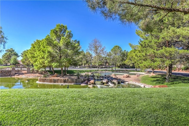 view of home's community with a lawn