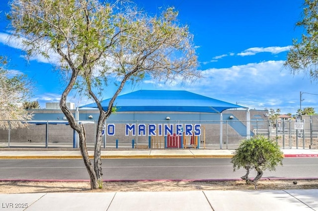 community sign featuring fence