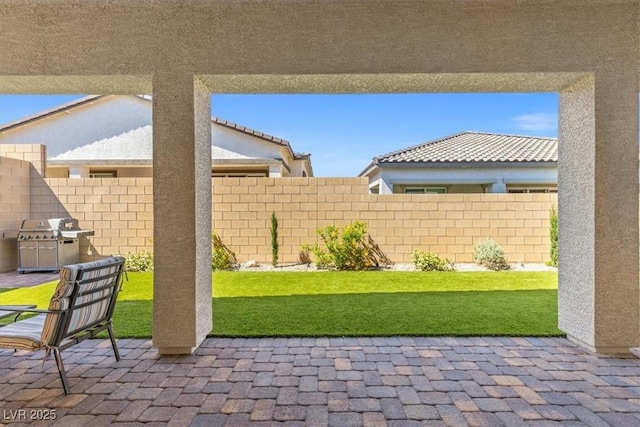 view of patio with fence and grilling area