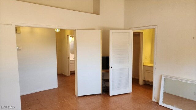 4285 El Como Way, Las Vegas, NV 89121 - unfurnished bedroom with light tile patterned floors