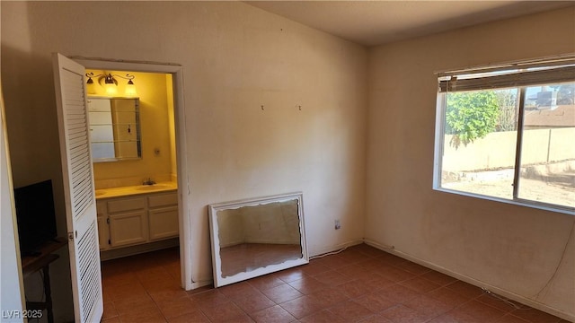 4285 El Como Way, Las Vegas, NV 89121 - spare room featuring dark tile patterned flooring and a sink