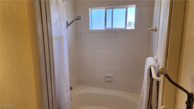 4285 El Como Way, Las Vegas, NV 89121 - bathroom with a textured wall and shower / washtub combination