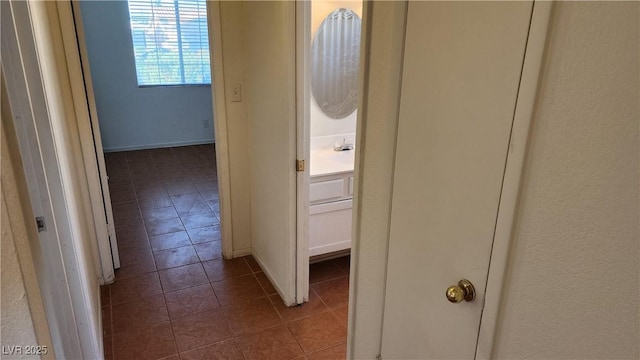 4285 El Como Way, Las Vegas, NV 89121 - corridor featuring dark tile patterned floors and baseboards