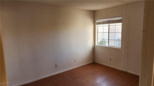 4285 El Como Way, Las Vegas, NV 89121 - tiled spare room with baseboards