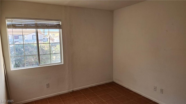 4285 El Como Way, Las Vegas, NV 89121 - empty room featuring baseboards and dark tile patterned flooring
