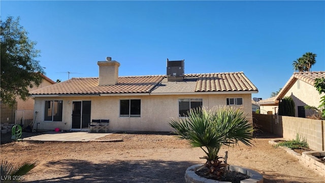 4285 El Como Way, Las Vegas, NV 89121 - back of house featuring a tiled roof, a chimney, and stucco siding