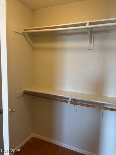 4285 El Como Way, Las Vegas, NV 89121 - spacious closet featuring dark tile patterned flooring