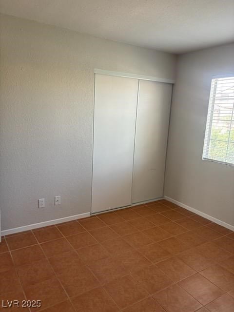 4285 El Como Way, Las Vegas, NV 89121 - unfurnished bedroom featuring a closet and baseboards