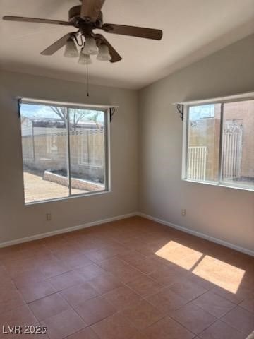 4285 El Como Way, Las Vegas, NV 89121 - empty room featuring a ceiling fan, vaulted ceiling, and tile patterned floors