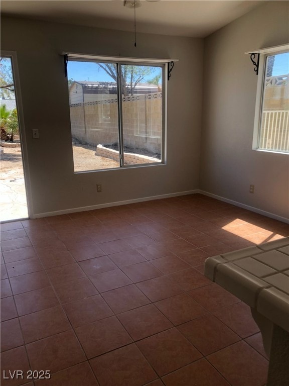 4285 El Como Way, Las Vegas, NV 89121 - tiled spare room featuring baseboards