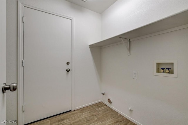 laundry room featuring light wood-style flooring, washer hookup, gas dryer hookup, and baseboards
