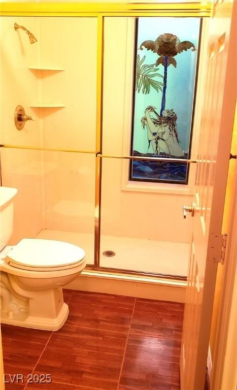 3954 Saddlewood Ct, Las Vegas, NV 89121 - full bathroom with a shower stall, toilet, and wood finished floors