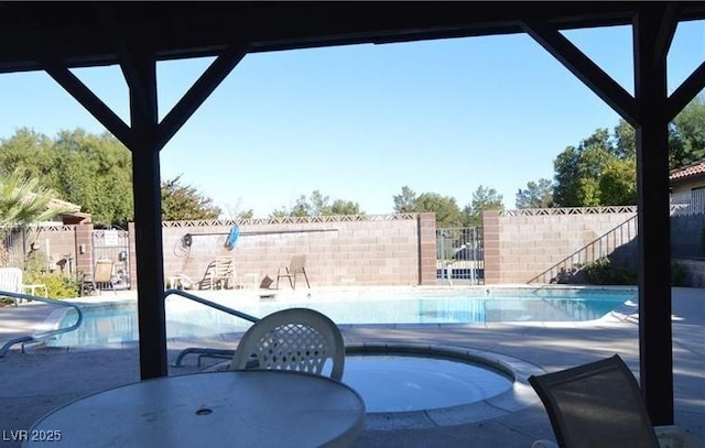 3954 Saddlewood Ct, Las Vegas, NV 89121 - community pool featuring a patio area and outdoor dining space