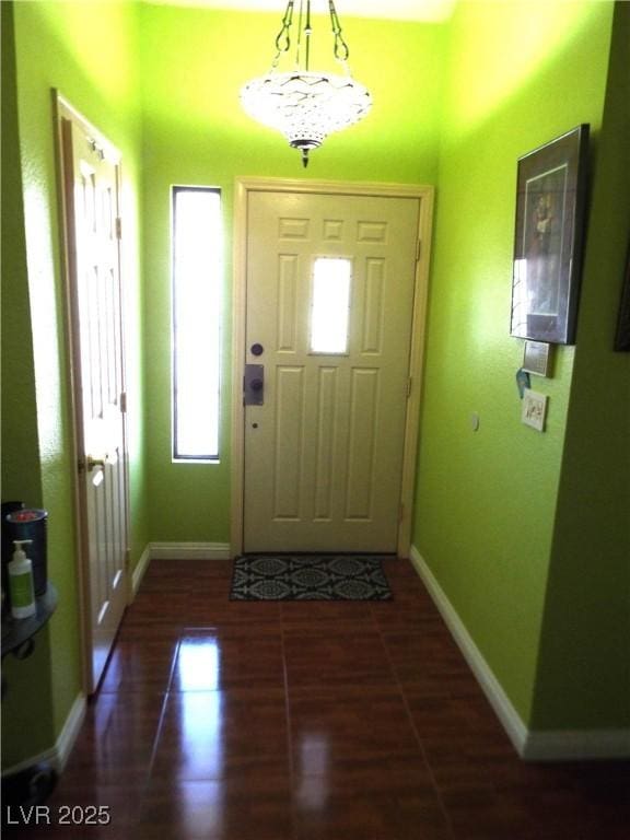 3954 Saddlewood Ct, Las Vegas, NV 89121 - foyer entrance with baseboards and wood finished floors