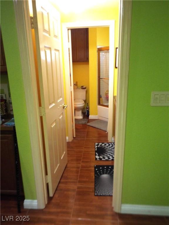 3954 Saddlewood Ct, Las Vegas, NV 89121 - hallway featuring baseboards and wood finished floors