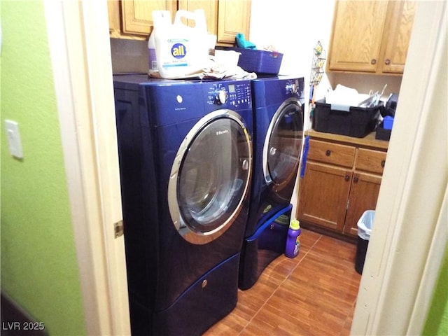 3954 Saddlewood Ct, Las Vegas, NV 89121 - laundry room featuring washer and dryer, cabinet space, and wood finished floors